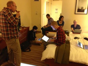 Photo of OWOT dev team members working hotel room.
