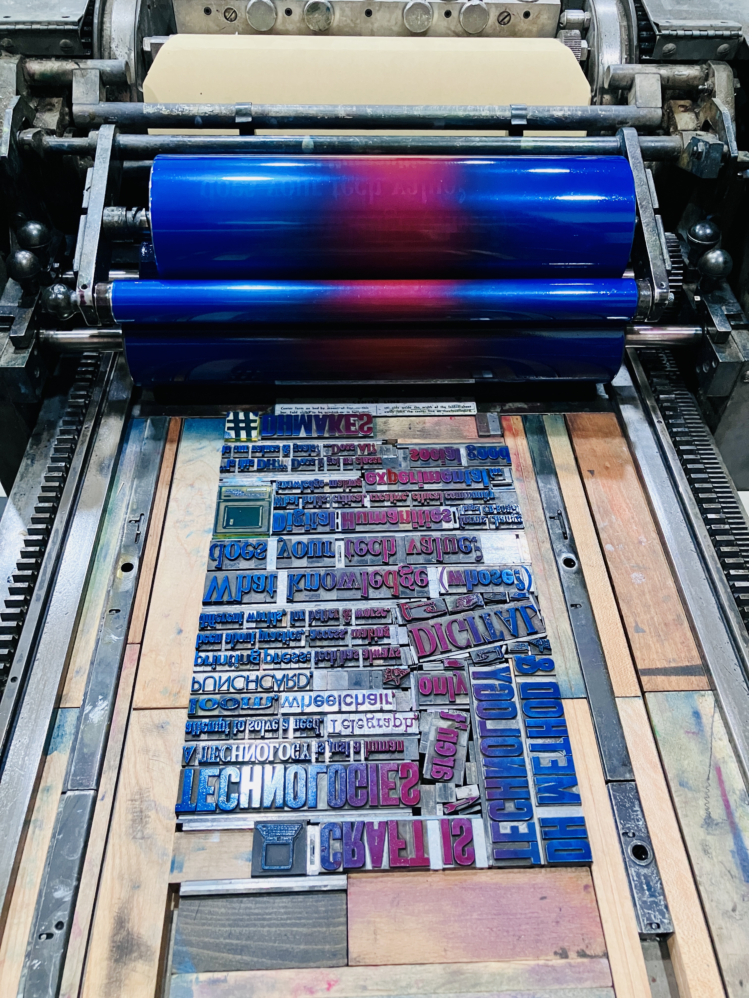 Photo of inked press & type for this print